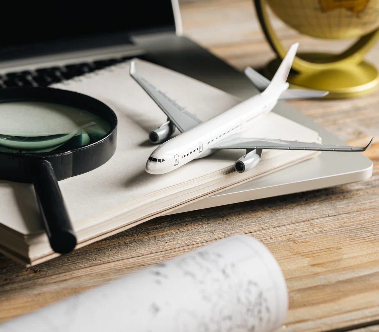 travel-composition-with-airplane-magnifying-glass-2023-11-27-04-59-46-utc-scaled